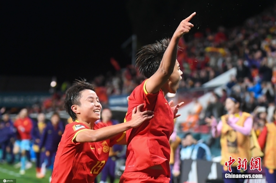 Shoupeng Wang (right) and Zhang Linyan celebrate the goal in the World Cup. Image source: IC photo